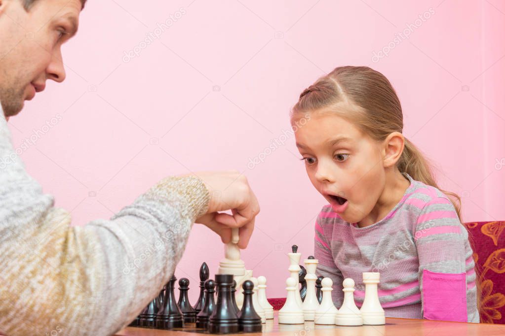 Chess coach reviewing opening positions with a student